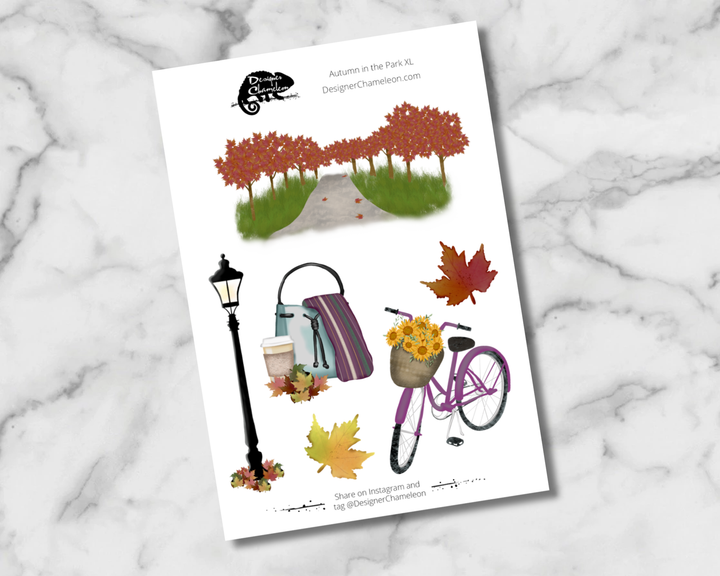 Autumn in the Park XL sticker sheet with a tree-lined path, lamppost, bag and drink, purple bicycle, flowers and autumn leaves.